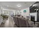 Open-concept living room featuring a fireplace and seamless access to the kitchen at 1245 Pebble Grove Dr, Clover, SC 29710