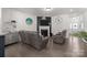 Spacious living area with hardwood floors, a fireplace, and modern furnishings at 1245 Pebble Grove Dr, Clover, SC 29710