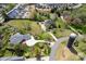 An aerial shot captures a sprawling estate with lush greenery, neighboring homes and mature trees at 12932 Westmoreland Farm Rd, Davidson, NC 28036
