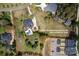Aerial view of the property showcasing the home, pool, surrounding lot, and landscaping at 12932 Westmoreland Farm Rd, Davidson, NC 28036