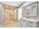 Spa like bathroom with large glass shower and vanity at 12932 Westmoreland Farm Rd, Davidson, NC 28036