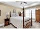 Comfortable bedroom features four-poster bed and side tables at 12932 Westmoreland Farm Rd, Davidson, NC 28036