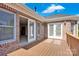 Spacious wooden deck featuring brick accents and direct access to indoor living spaces at 12932 Westmoreland Farm Rd, Davidson, NC 28036