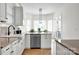 Bright kitchen with stainless steel appliances, granite countertops, and an open layout at 12932 Westmoreland Farm Rd, Davidson, NC 28036