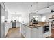 Spacious kitchen features an island with granite countertops, stainless steel appliances, and ample counter space at 12932 Westmoreland Farm Rd, Davidson, NC 28036