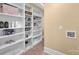 Well-organized storage area with built-in shelving and tile flooring at 12932 Westmoreland Farm Rd, Davidson, NC 28036