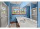 Well-lit bathroom with a single sink vanity, neutral counter and large mirror at 1315 Arbor Dr, Salisbury, NC 28144