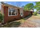 Charming red brick home featuring a well-maintained lawn and inviting front entrance at 1315 Arbor Dr, Salisbury, NC 28144