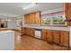 Bright eat-in kitchen with wood cabinets, and laminate floors at 1315 Arbor Dr, Salisbury, NC 28144
