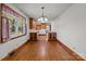 Cozy kitchen with hardwood floors, built-in cabinets, and a window overlooking the yard at 1315 Arbor Dr, Salisbury, NC 28144
