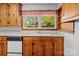 Traditional kitchen featuring wood cabinets, neutral countertops, and classic appliances at 1315 Arbor Dr, Salisbury, NC 28144