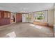 Open-concept living room with large windows offering plenty of natural light at 1315 Arbor Dr, Salisbury, NC 28144