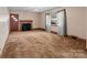 Comfortable living room with fireplace, large window and cozy carpeting at 1315 Arbor Dr, Salisbury, NC 28144
