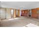 Large living space with carpet, vintage wall paper and built-in shelving at 1315 Arbor Dr, Salisbury, NC 28144