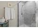 Modern bathroom features a glass-enclosed shower with tiled walls and a stylish vanity at 1354 Galloway Rd, Charlotte, NC 28262