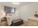 Comfortable bedroom with soft lighting, stylish decor, and a cozy bed at 1354 Galloway Rd, Charlotte, NC 28262