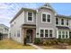Stylish two-story townhouse with gray siding, stone details, and well-maintained landscaping at 1354 Galloway Rd, Charlotte, NC 28262