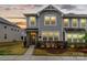 Charming two-story home showcasing stone accents, a well-manicured lawn, and a welcoming entrance at 1354 Galloway Rd, Charlotte, NC 28262
