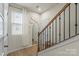Hallway with natural light, hardwood floors, and white doors and trim at 1354 Galloway Rd, Charlotte, NC 28262