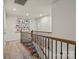 Upstairs hallway features carpeted floors and a decoratively adorned white wall at 1354 Galloway Rd, Charlotte, NC 28262