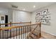 Upstairs hallway features carpeted floors and decoratively adorned white walls at 1354 Galloway Rd, Charlotte, NC 28262