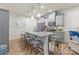 Kitchen with a granite island countertop, light gray cabinets, stainless steel appliances, and bar stool seating at 1354 Galloway Rd, Charlotte, NC 28262