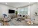 Comfortable living room featuring stylish seating, a large TV, and a cozy atmosphere at 1354 Galloway Rd, Charlotte, NC 28262