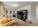 Cozy living room filled with natural light, plush carpets, built-in shelving, and neutral-colored walls at 1354 Galloway Rd, Charlotte, NC 28262