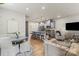 Open-concept living and kitchen area with a granite island and stylishly appointed seating at 1354 Galloway Rd, Charlotte, NC 28262