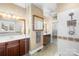 Bathroom featuring double sinks, decorative tile work and a glass-enclosed shower at 13924 Island Dr, Huntersville, NC 28078