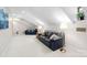 Large bonus room offers ample seating and bright, natural light at 13924 Island Dr, Huntersville, NC 28078