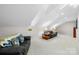 Expansive bonus room features vaulted ceilings and comfortable seating for entertaining at 13924 Island Dr, Huntersville, NC 28078