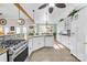 Bright kitchen with granite countertops, white cabinets, and stainless steel appliances at 13924 Island Dr, Huntersville, NC 28078