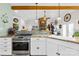 View of the kitchen with a gas range and granite countertops at 13924 Island Dr, Huntersville, NC 28078