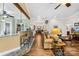Open-concept living room with bar seating, wood floors, and lots of natural light at 13924 Island Dr, Huntersville, NC 28078
