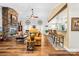 Spacious living room with a stone fireplace, hardwood floors, and ample natural light, perfect for relaxation at 13924 Island Dr, Huntersville, NC 28078