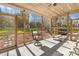 Relaxing screened porch offers outdoor seating and views of the green backyard at 13924 Island Dr, Huntersville, NC 28078