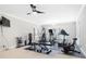 Bright home exercise room with large windows and neutral walls, featuring treadmill and weight machines at 1404 Churchill Downs Dr, Waxhaw, NC 28173