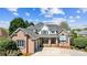 Beautiful two-story home showcasing a spacious driveway and manicured front yard at 1404 Churchill Downs Dr, Waxhaw, NC 28173