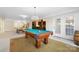 Game room features a pool table, ping pong table and bar area for entertaining at 1404 Churchill Downs Dr, Waxhaw, NC 28173