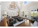 Spacious living room with high ceilings, hardwood floors, and large windows for natural light at 1404 Churchill Downs Dr, Waxhaw, NC 28173
