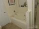Doorway view of soaking tub, glass shower and decorative shelf at 158 Margaret Turner Rd, Charlotte, NC 28216