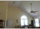 Bright living room with vaulted ceiling, large window, and an ornate ceiling fan at 158 Margaret Turner Rd, Charlotte, NC 28216