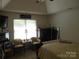 Calm main bedroom featuring a vaulted ceiling, ceiling fan, and window views at 158 Margaret Turner Rd, Charlotte, NC 28216