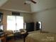 Tranquil main bedroom with vaulted ceiling, ceiling fan, and comfortable seating at 158 Margaret Turner Rd, Charlotte, NC 28216