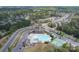 Bird's eye view of community pool, clubhouse, tennis court, and surrounding neighborhood at 16803 Cozy Cove Rd, Charlotte, NC 28278