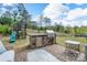 Entertainer's backyard featuring an outdoor kitchen, patio, and a wooden playset at 16803 Cozy Cove Rd, Charlotte, NC 28278
