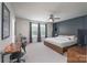 Bright bedroom with large windows, modern decor, and ample space for relaxation at 16803 Cozy Cove Rd, Charlotte, NC 28278