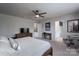 Well-lit bedroom featuring carpet, large windows, neutral walls, and a ceiling fan at 16803 Cozy Cove Rd, Charlotte, NC 28278