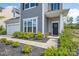 Inviting front entrance featuring a well-maintained walkway, a decorative wreath, and attractive landscaping at 16803 Cozy Cove Rd, Charlotte, NC 28278